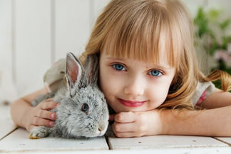 Child with bunny on new floor